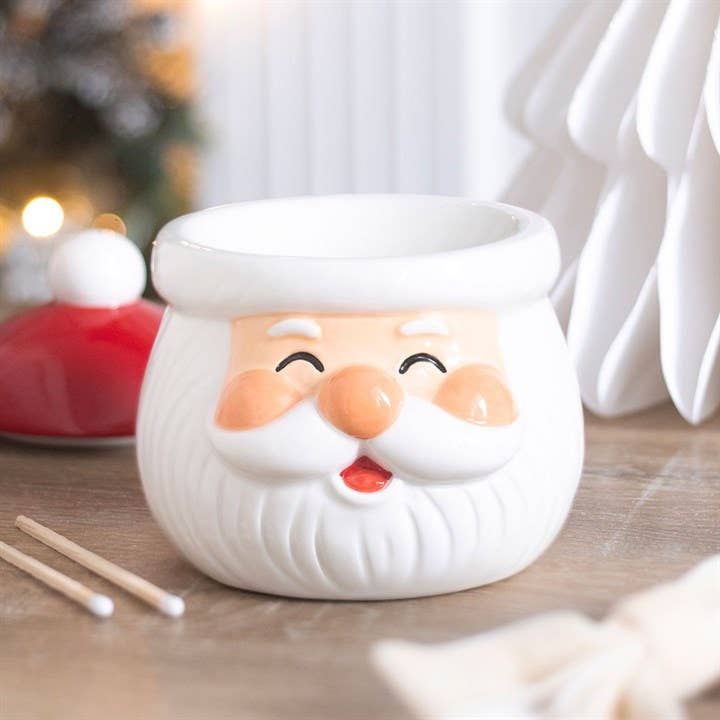 Fröhlicher Weihnachtsmann Ölbrenner und Wachswärmer