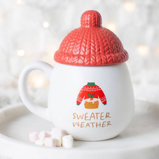Weihnachtstasse mit Deckel und Strickmuster-Mütze