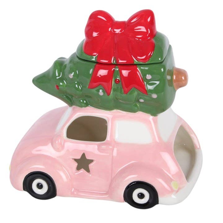 Rosa Auto mit Weihnachtsbaum-Ölbrenner